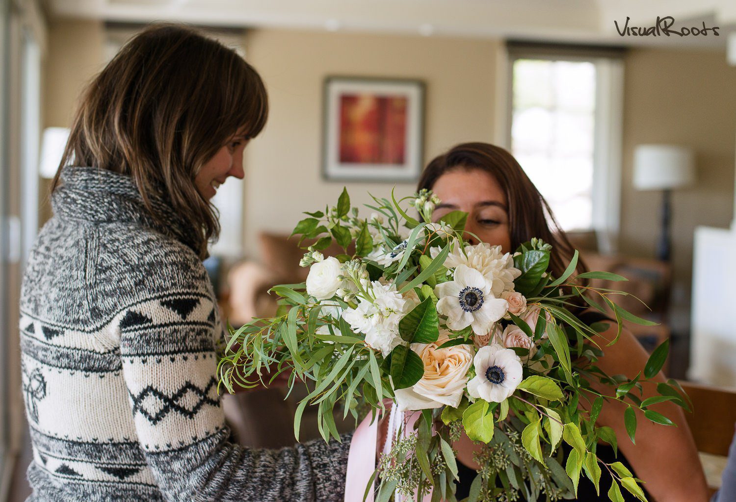 Florist giving flowers to the bride inside